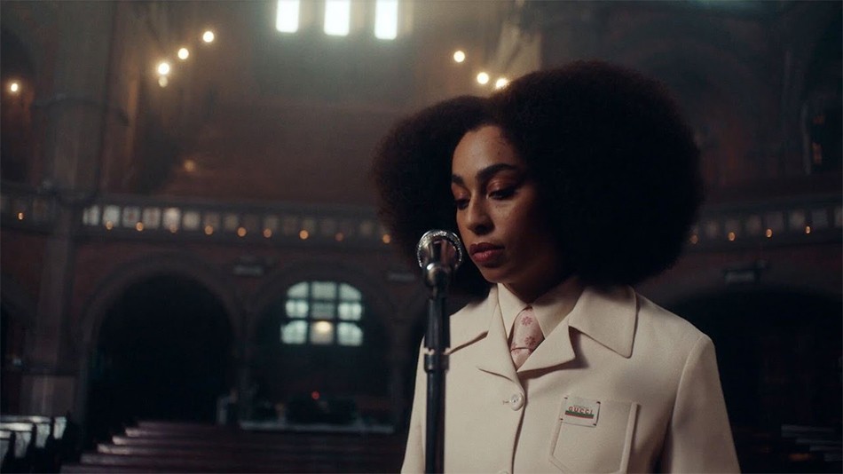 BRIT award-winning singer-songwriter Celeste singing into a mic at Union Chapel.