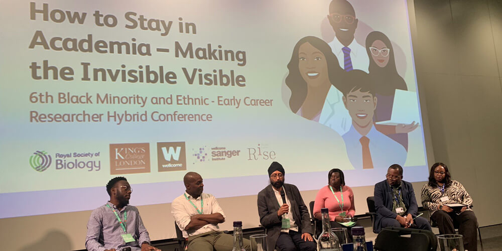 Speakers on stage at the Black Minority and Ethnic Early Career Researcher - How to Stay in Academia conference 2022