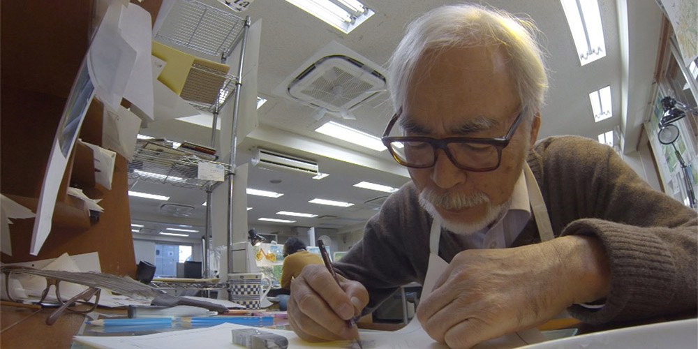 Animation master, Hayao Miyazaki, drawing by hand in his studio