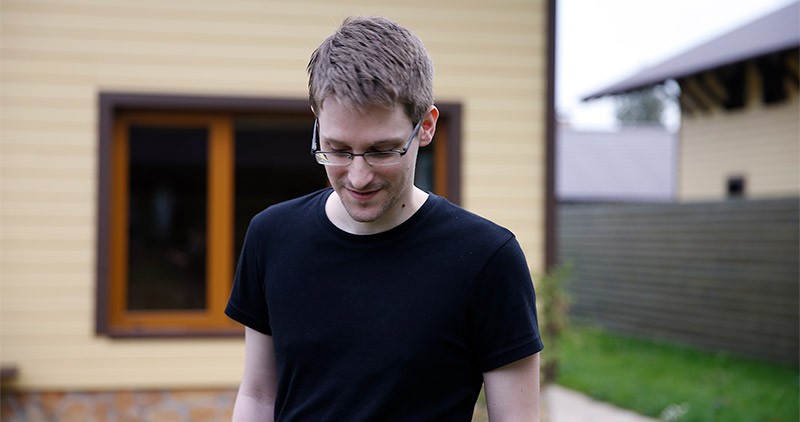 Edward Snowdon in front of a house