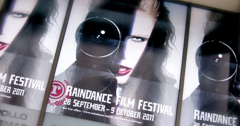 Poster of woman holding a camera for Raindance Film Festival